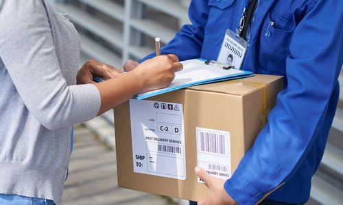 Customer signing for a parcel delivery